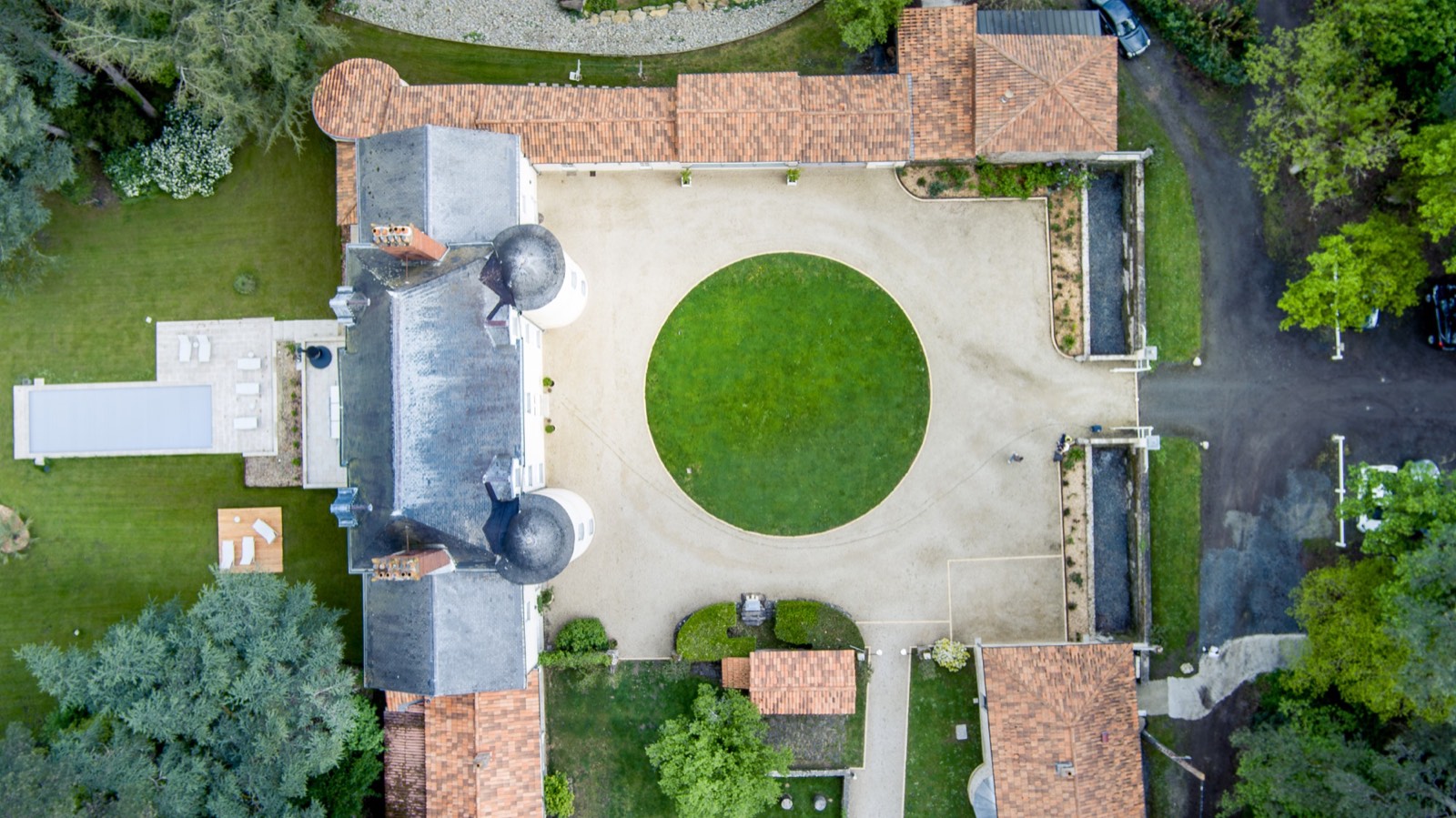 Overhead aerial view of a property and its courtyard