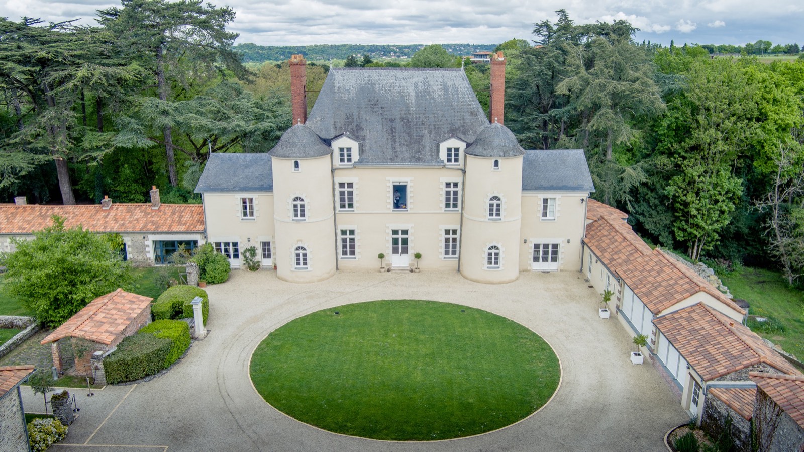 Aerial view of a property's façade and architectural scale
